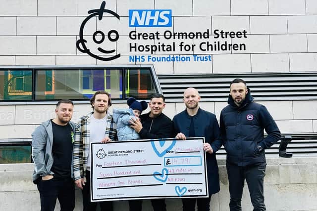 A cheque presentation to GOSH after the 48 miles in 48 hours challenge. Left to right: Craig Schurek, Conor Inskip, Joe Aris holding Nancy, Zak Henry, Bradleigh Smith. Dean Hamilton also took part, but couldn’t make the photo. Image supplied by the Aris family.