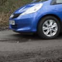 Pot holes in road surface. Photo by National Motor Museum/Heritage Images via Getty Images