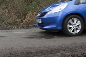 Pot holes in road surface. Photo by National Motor Museum/Heritage Images via Getty Images