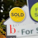 File photo of for sale signs.