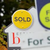 File photo of for sale signs.