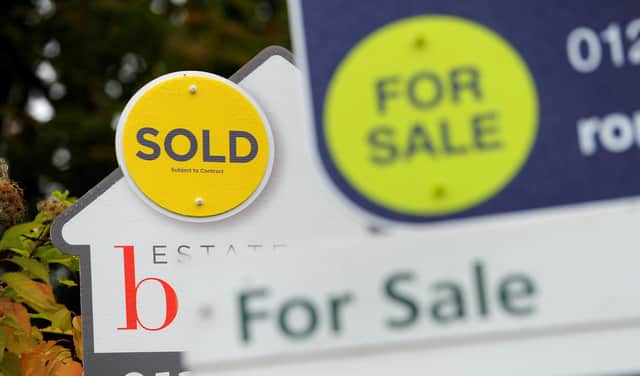 File photo of for sale signs.