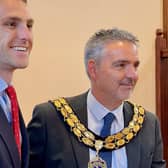 New mayor Mark Foster is handed the chains of office by outgoing mayor Grant Fage