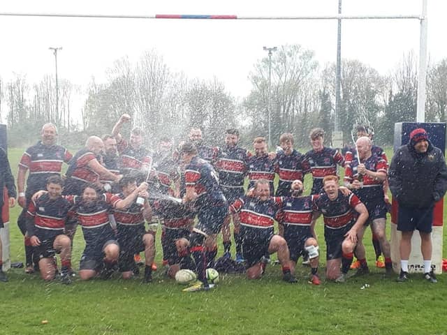 Biggleswade's first team celebrate in style after they won the Midlands Four East (South) title thanks to an emphatic 69-3 victory over South Leicester