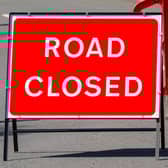 Temporary red road closed sign