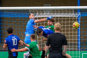 George Rose punches the ball to safety. Image: Guy Wills.