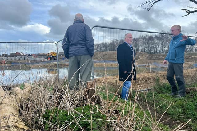 MP Richard Fuller visits the site of the flooding
