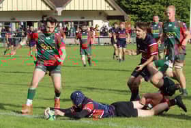 John Richardson goes over for a debut try. Photo by Lisa Dillinger.
