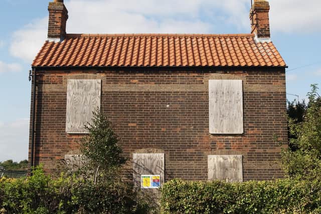 A boarded up house. (Photo by David Potter/Construction Photography/Avalon/Getty Images)