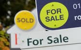 General view of Sold and For Sale signs outside a block of flats