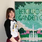 Potton artist Katie Hounsome pictured with the Lego art of her poster