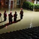 Emergency workers standing in flood water during the recent Central Bedfordshire floods. Picture: Debbie Ward