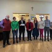 St Andrew's Church Reverend Liz Oglesby-Elong with representatives from Tibbs Dementia and Save The Children .