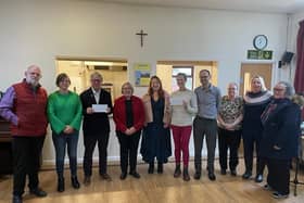 St Andrew's Church Reverend Liz Oglesby-Elong with representatives from Tibbs Dementia and Save The Children .