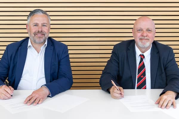 A representative from dbfb communications (left) and Adrian Dutch, Pro Vice Chancellor at the University of Bedfordshire (right)