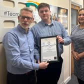 Lewis Mayo receives his Stagecoach Star of the Month Award from Darren Roe (left) and Hema Russell (right)