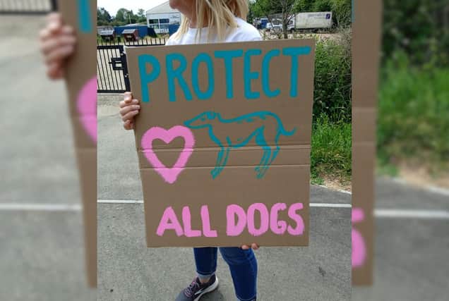 A protester outside Henlow Greyhound Stadium
