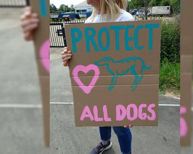 A protester outside Henlow Greyhound Stadium