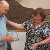 Cllr Aldis receives his plaque from Mayor Cllr J Hewitt