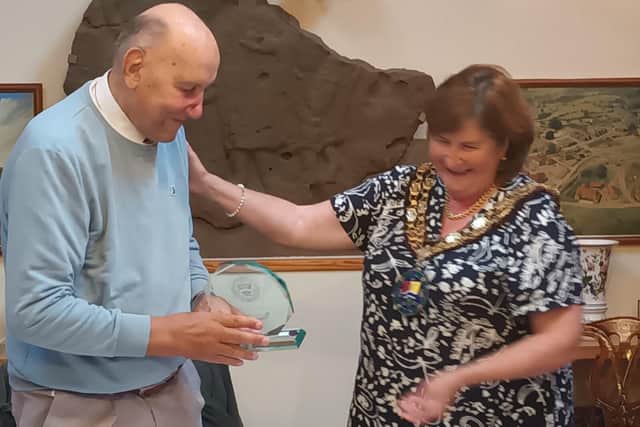 Cllr Aldis receives his plaque from Mayor Cllr J Hewitt