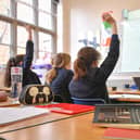 File photo of a teacher and students in a classroom.