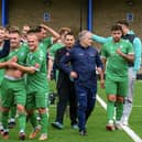Biggleswade FC celebrate their FA Cup win over Canvey Island, with joint-bosses Dave Northfield (front) and Mark Inskip (third from right). Photo: Guy Wills Photography.