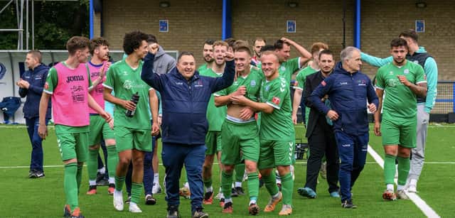 Biggleswade FC celebrate their FA Cup win over Canvey Island, with joint-bosses Dave Northfield (front) and Mark Inskip (third from right). Photo: Guy Wills Photography.