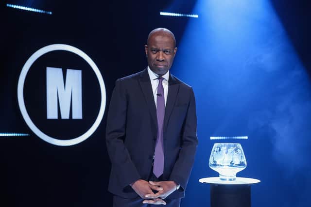 Clive Myrie with Mastermind Trophy