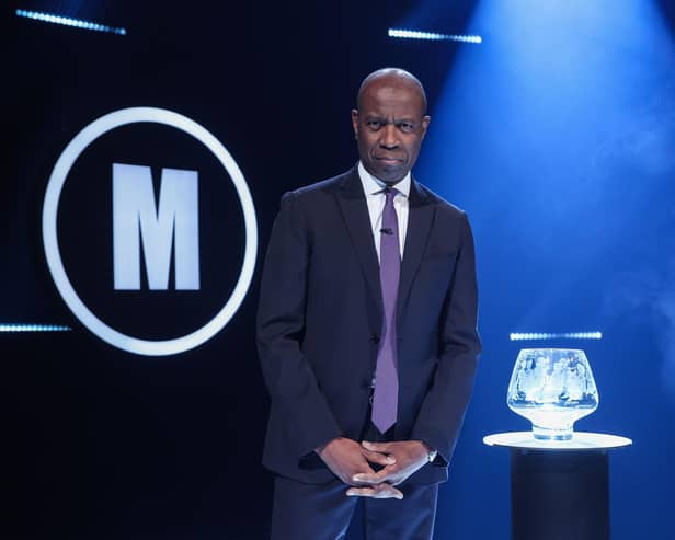 Clive Myrie with Mastermind Trophy