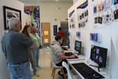 Visitors explore digital creations by Bedford College students.