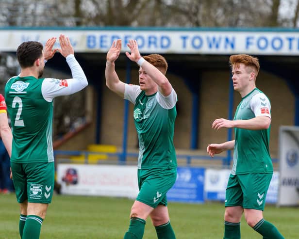 Alex Marsh is congratulated for one of his goals by Adam Hunt (left) and twin brother Lawrie. Photo: Guy Wills Photography.