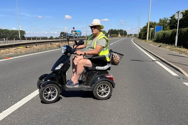 Pete Cross at the Tingey's Corner crossing as he travels to do a shopping trip in Sainsbury's. Image: Mike Wells.