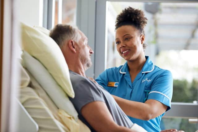 Sue Ryder Nurse supporting a patient