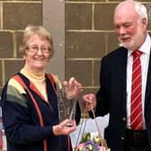 Janice receiving an engraved vase from Derek Batchelor, Chairman of the Bedfordshire Badminton Association.