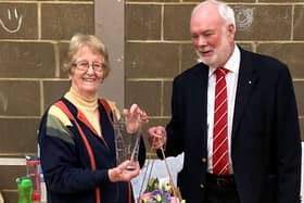 Janice receiving an engraved vase from Derek Batchelor, Chairman of the Bedfordshire Badminton Association.