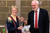 Janice receiving an engraved vase from Derek Batchelor, Chairman of the Bedfordshire Badminton Association.