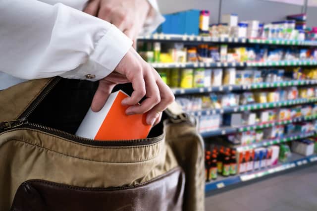 Stock image of a person shoplifting in a supermarket. Picture: Adobe Stock
