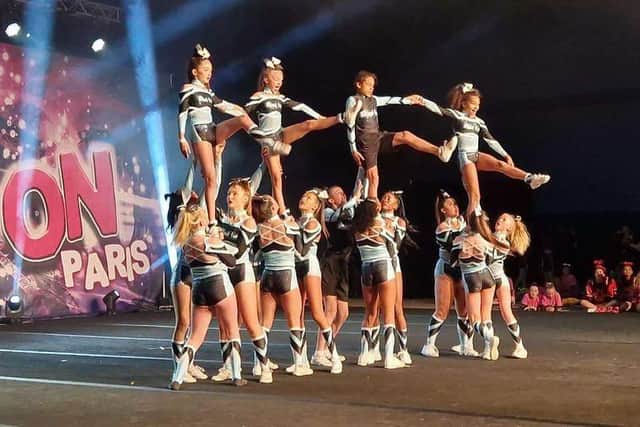 Molly Mayhew and her cheerleading team Black Ice show their winning form. Pic supplied by Leanne Mayhew