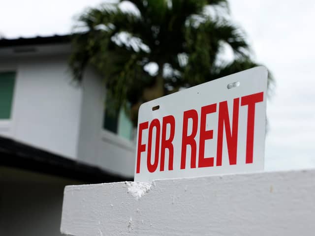 A "for rent" sign is posted in front of a home (Photo by Joe Raedle/Getty Images)
