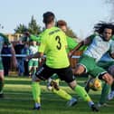 Action from Biggleswade Town's (in dark green) clash with Biggleswade FC. Photo: Guy Wills Photography.