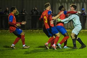 Biggleswade United's players celebrate after winning Saturday's shoot-out. Photo by Cosmin Iftode.