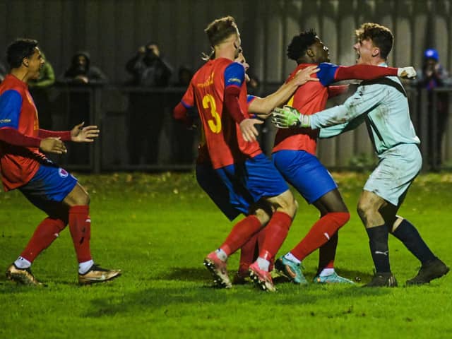 Biggleswade United's players celebrate after winning Saturday's shoot-out. Photo by Cosmin Iftode.