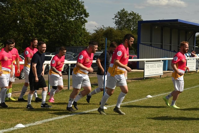 Players (Adam's family and friends) run on to the pitch.