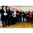 Smiles all round during the cheque presentation evening at Sandy Village Hall.