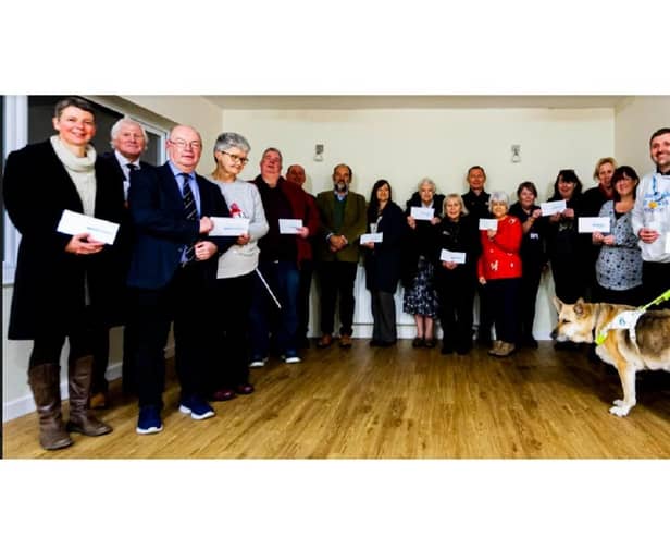 Smiles all round during the cheque presentation evening at Sandy Village Hall.