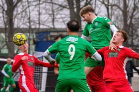 Pat McCafferty heads home the winner for Biggleswade FC on Saturday. Photo: Guy Wills.