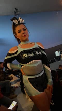 Brave Molly Mayhew hasn't allowed a painful condition to stop her cheerleading - she and her Black Ice team mates will compete at an international summit in Orlando this summer. Pic supplied by Leanne Mayhew
