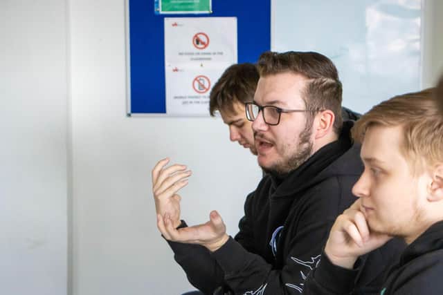 Student Liam Wilmot talking to Graham