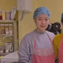 Twee photographed on the right with her assistant Lin