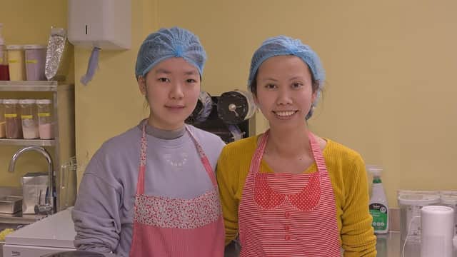 Twee photographed on the right with her assistant Lin